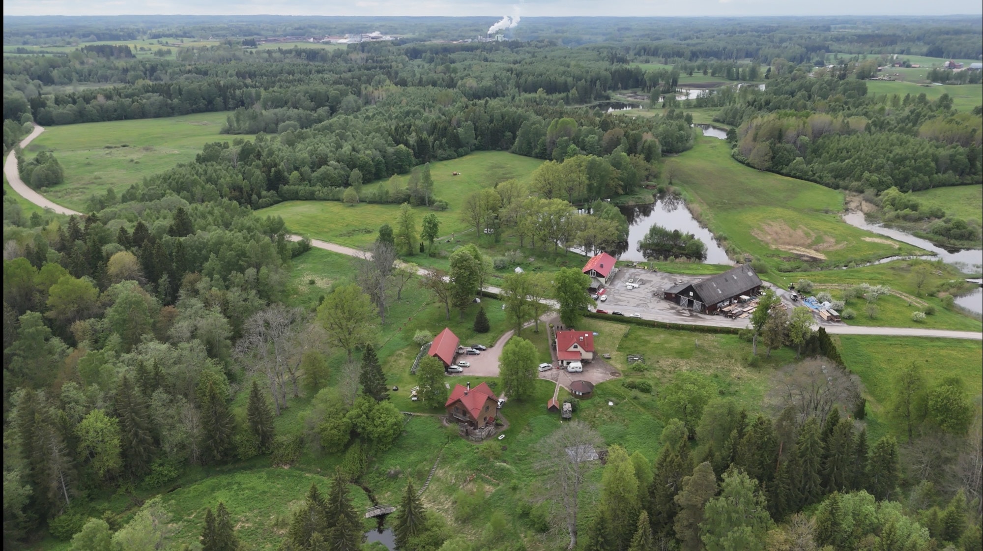 Aerial view of the farmstead, fields and ponds